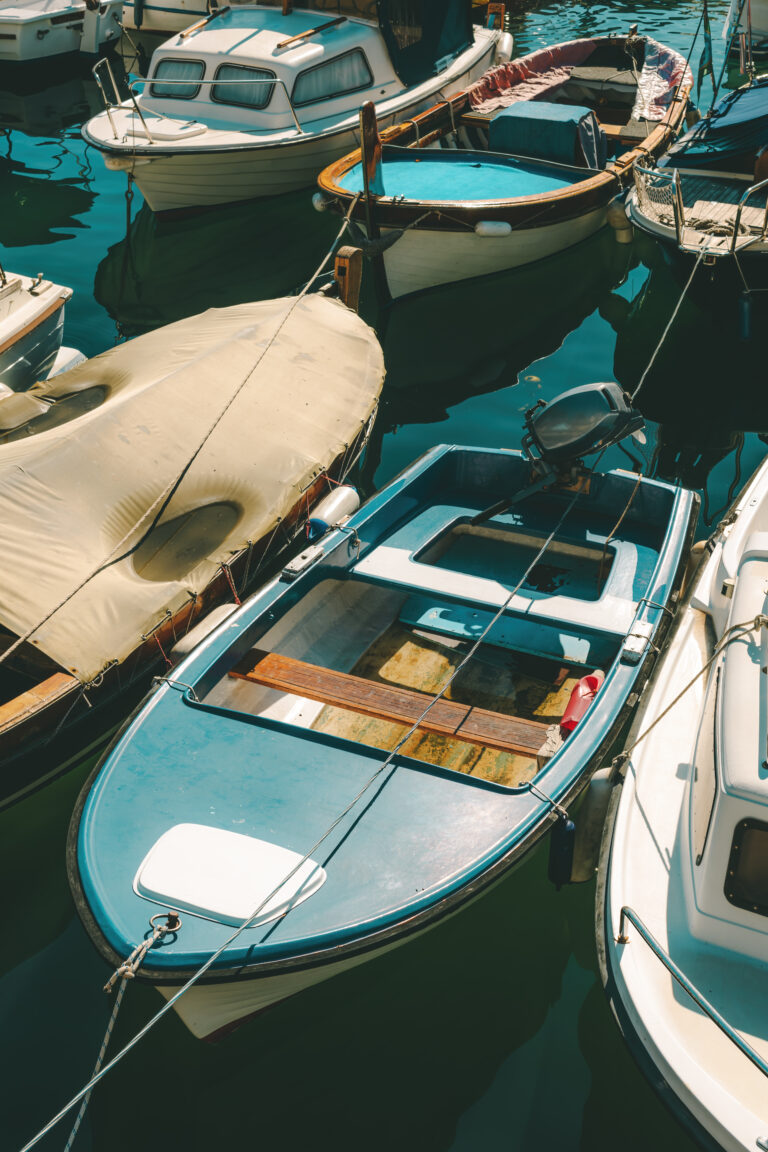 Home fishing dinghy boats moored in small marina in town of lovran, c