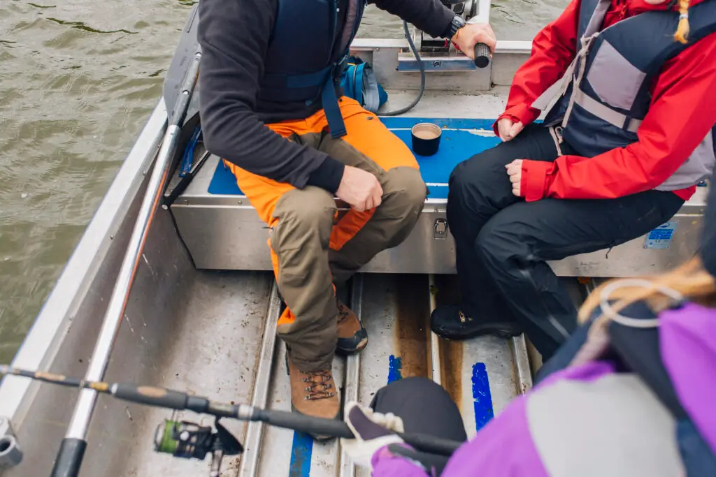 Family sitting in a boat on a lake